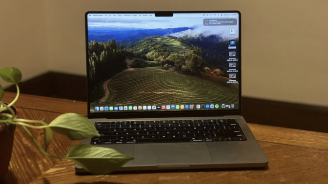 MacBook Pro (M3) on a desktop with plant